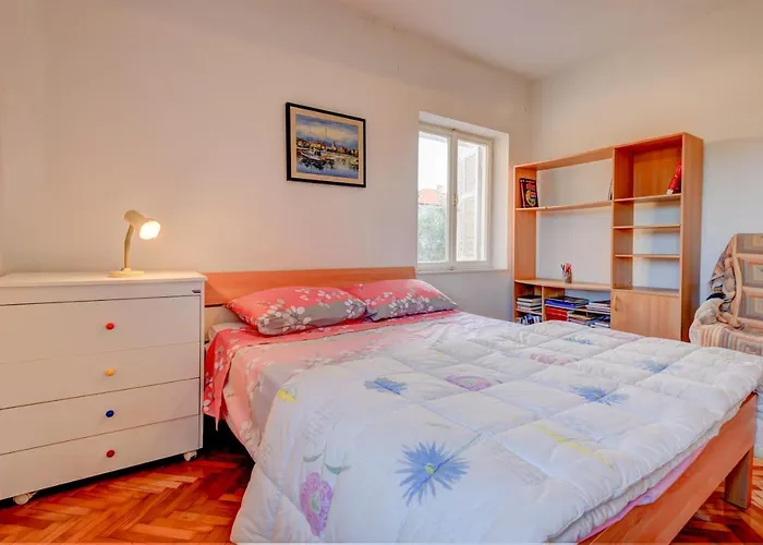 The Consists Of Two Bedrooms, A Bathroom, A Kitchen And A Living Apartament